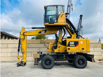 Bager za prekladanje primarnih/ Sekundarnih surovin CATERPILLAR MH3024