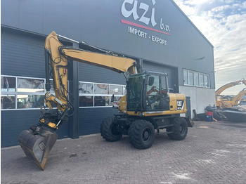 Bager na kolesih CATERPILLAR M313D