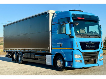 Tovornjak s ponjavo MAN TGX