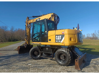 Bager na kolesih CATERPILLAR M313D
