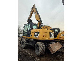 Bager na kolesih CATERPILLAR 313D