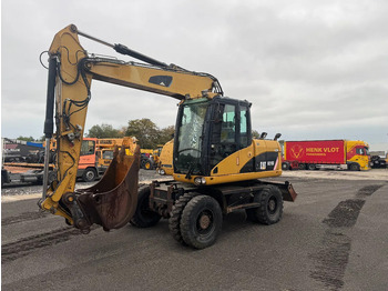 Bager na kolesih CATERPILLAR M313D