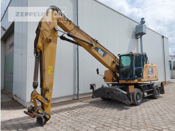 Bager za prekladanje primarnih/ Sekundarnih surovin CATERPILLAR MH3024