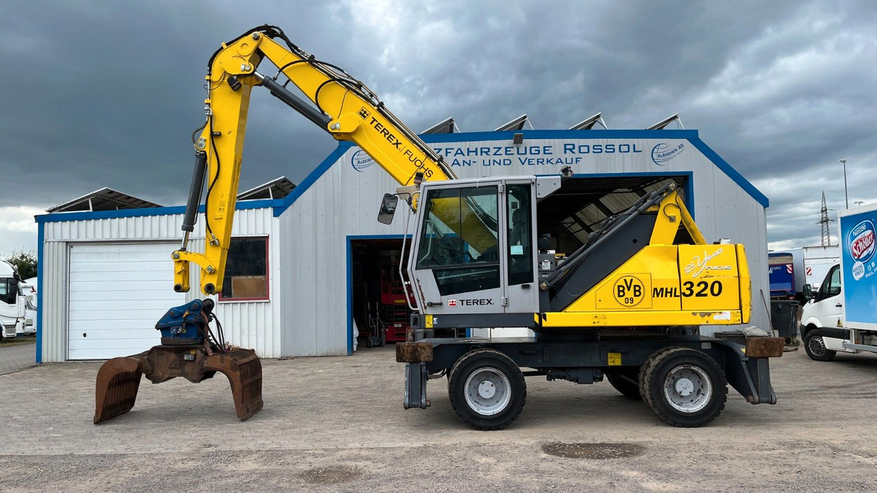 Fuchs TeRex MHL 320 D Umschlagbagger Greifer Pratzen - Bager za prekladanje primarnih/ Sekundarnih surovin: slika 1 Fuchs TeRex MHL 320 D Umschlagbagger Greifer Pratzen - Bager za prekladanje primarnih/ Sekundarnih surovin: slika 1