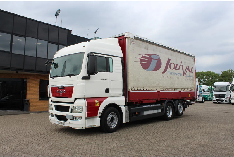 MAN TGX 26.440 * EURO5 * 6X2 * LIFT AXLE * - Tovornjak s ponjavo: slika 1 MAN TGX 26.440 * EURO5 * 6X2 * LIFT AXLE * - Tovornjak s ponjavo: slika 1
