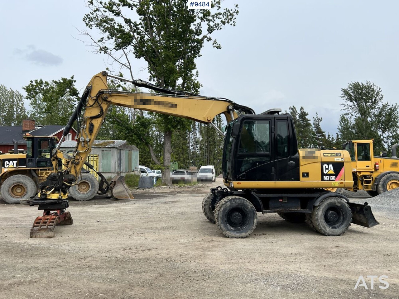 CAT M313D with tipping wagon and attachments (VIDEO) - Bager na kolesih: slika 2 CAT M313D with tipping wagon and attachments (VIDEO) - Bager na kolesih: slika 2