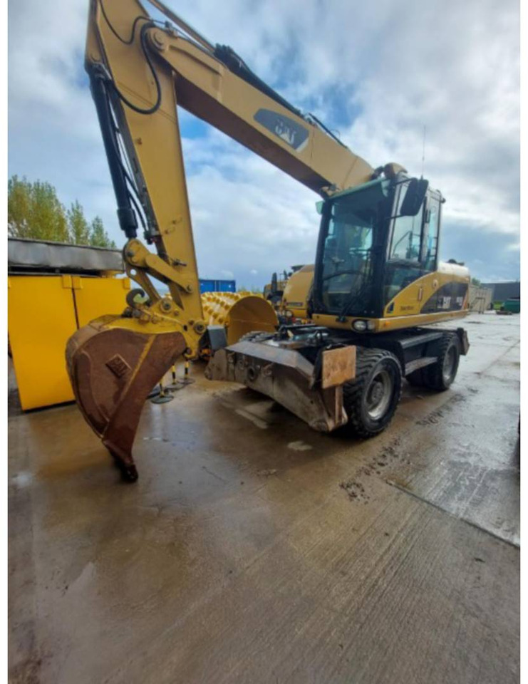 CAT M315D - Bager na kolesih: slika 1 CAT M315D - Bager na kolesih: slika 1