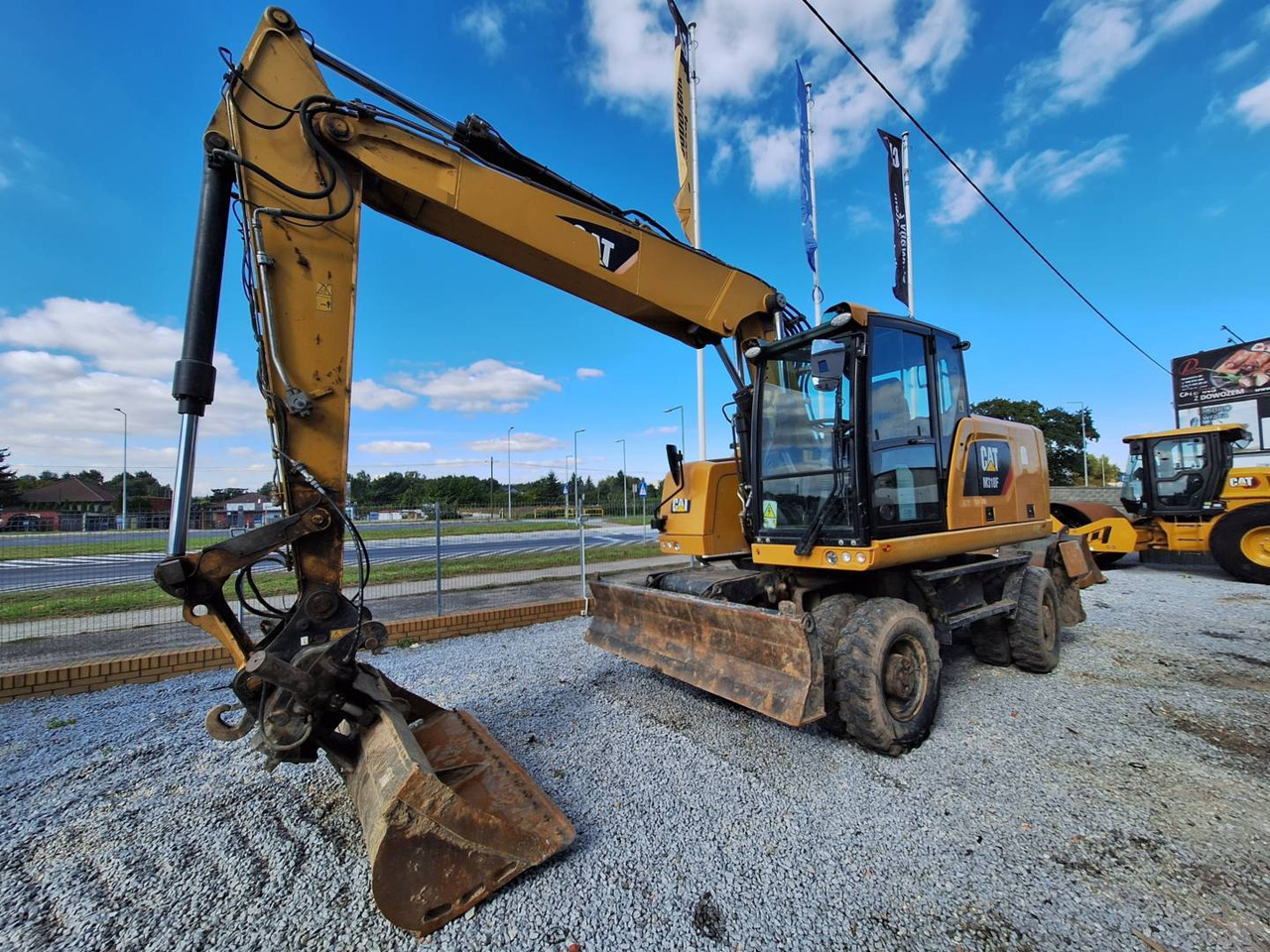 CAT M318F - Bager na kolesih: slika 1 CAT M318F - Bager na kolesih: slika 1