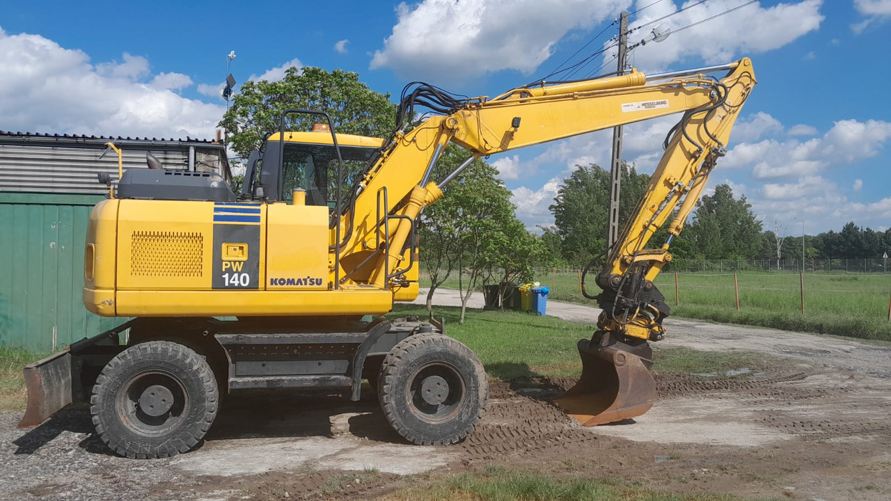 KOMATSU PW 140-7 - Bager na kolesih: slika 1 KOMATSU PW 140-7 - Bager na kolesih: slika 1