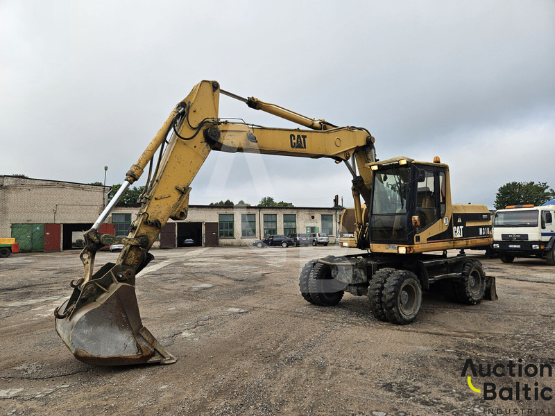 Caterpillar M 318 C - Bager na kolesih: slika 1 Caterpillar M 318 C - Bager na kolesih: slika 1