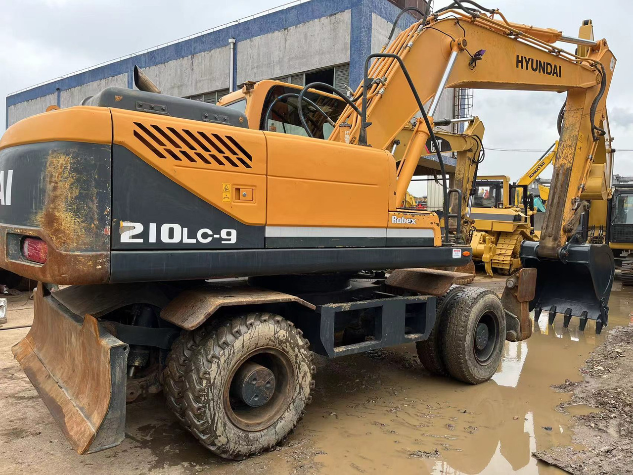 HYUNDAI R210W-9 - Bager na kolesih: slika 1 HYUNDAI R210W-9 - Bager na kolesih: slika 1