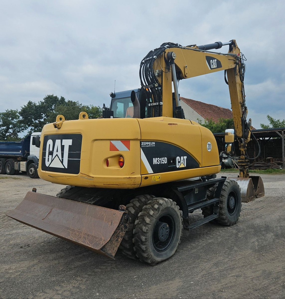 CAT M315D orig. 4.129h - Bager na kolesih: slika 2 CAT M315D orig. 4.129h - Bager na kolesih: slika 2
