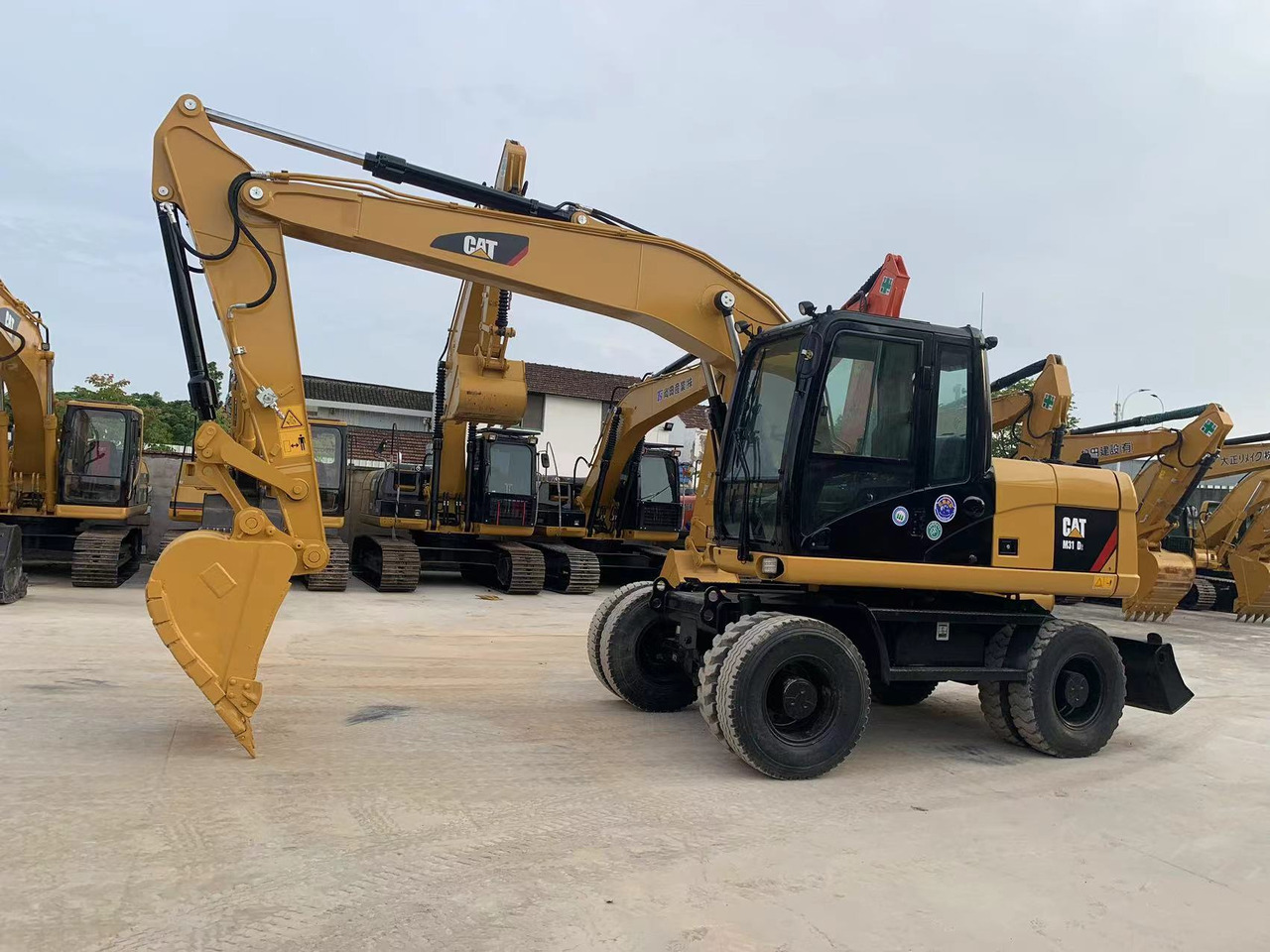 Caterpillar M315D Wheel Excavator Moving by Tires - Bager na kolesih: slika 2 Caterpillar M315D Wheel Excavator Moving by Tires - Bager na kolesih: slika 2