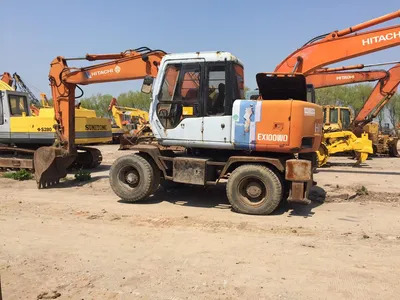Original Color Tire Excavator Hitachi Ex100wd Ex160wd Moving by Wheels - Bager goseničar: slika 1 Original Color Tire Excavator Hitachi Ex100wd Ex160wd Moving by Wheels - Bager goseničar: slika 1