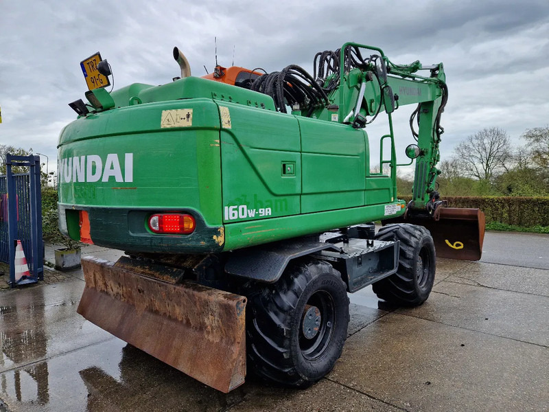 Hyundai Robex 160W-9A met 6-cilinder Cummins motor - Bager na kolesih: slika 4 Hyundai Robex 160W-9A met 6-cilinder Cummins motor - Bager na kolesih: slika 4