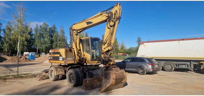 Caterpillar M 315 Rototilt - Bager na kolesih: slika 1 Caterpillar M 315 Rototilt - Bager na kolesih: slika 1