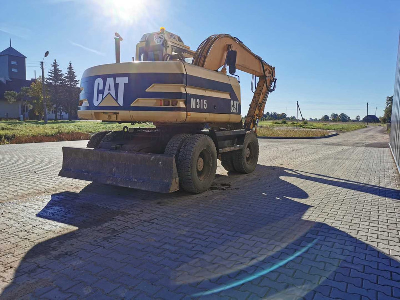 Caterpillar M315 wheel excavator - Bager na kolesih: slika 5 Caterpillar M315 wheel excavator - Bager na kolesih: slika 5