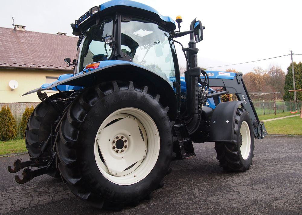 Ciągnik New Holland NH TS125A 6 cylindrów 2004 Ciągnik rolniczy New Holland TS125A - Traktor: slika 4 Ciągnik New Holland NH TS125A 6 cylindrów 2004 Ciągnik rolniczy New Holland TS125A - Traktor: slika 4