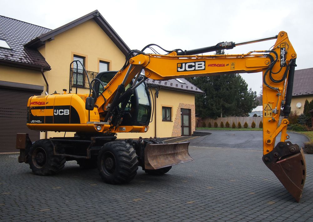 Koparka kołowa JCB JS145W 2011 Koparka JCB - Bager na kolesih: slika 1 Koparka kołowa JCB JS145W 2011 Koparka JCB - Bager na kolesih: slika 1