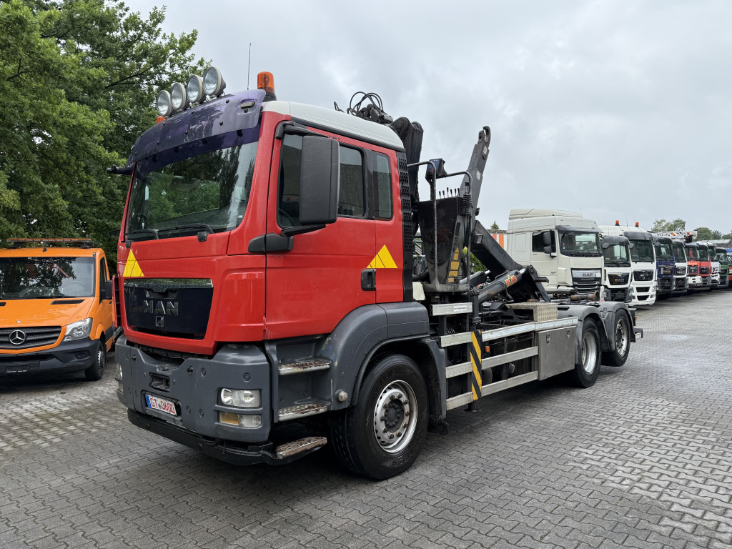 MAN TGS 26.360 6X2 Haken mit Kran HMF 1643Z - Kotalni prekucni tovornjak, Tovornjak z dvigalom: slika 1 MAN TGS 26.360 6X2 Haken mit Kran HMF 1643Z - Kotalni prekucni tovornjak, Tovornjak z dvigalom: slika 1