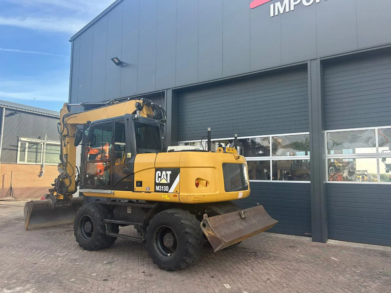 Caterpillar M313D - Bager na kolesih: slika 2 Caterpillar M313D - Bager na kolesih: slika 2