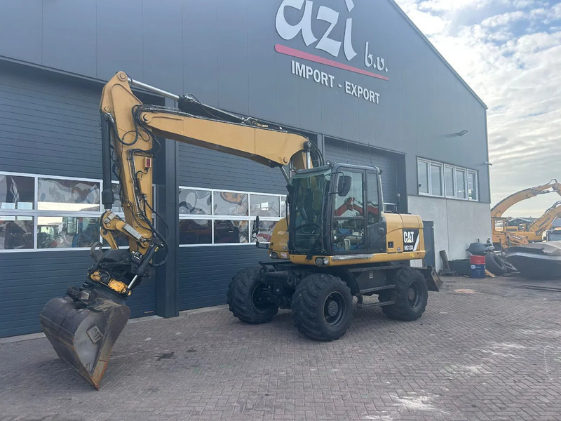 Caterpillar M313D - Bager na kolesih: slika 1 Caterpillar M313D - Bager na kolesih: slika 1