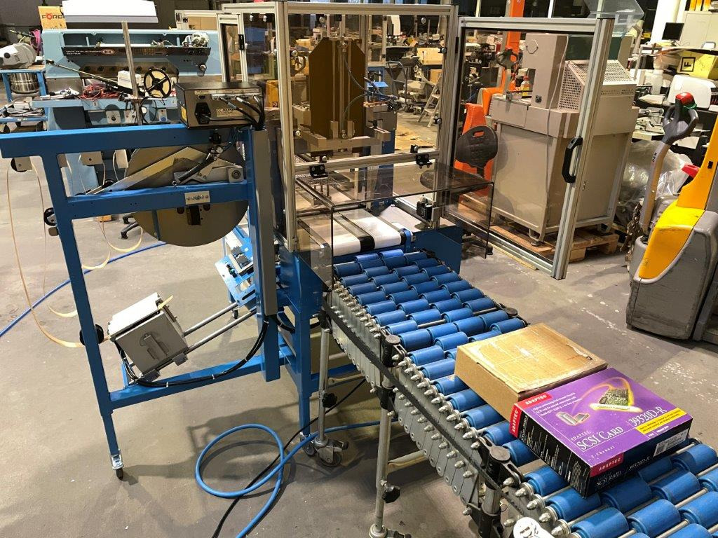 ATS Tanner UltraSonic US 2000-AB transit banding machine with pneumatic product hold-down and infeed roller table - Oprema za pakiranje: slika 1 ATS Tanner UltraSonic US 2000-AB transit banding machine with pneumatic product hold-down and infeed roller table - Oprema za pakiranje: slika 1