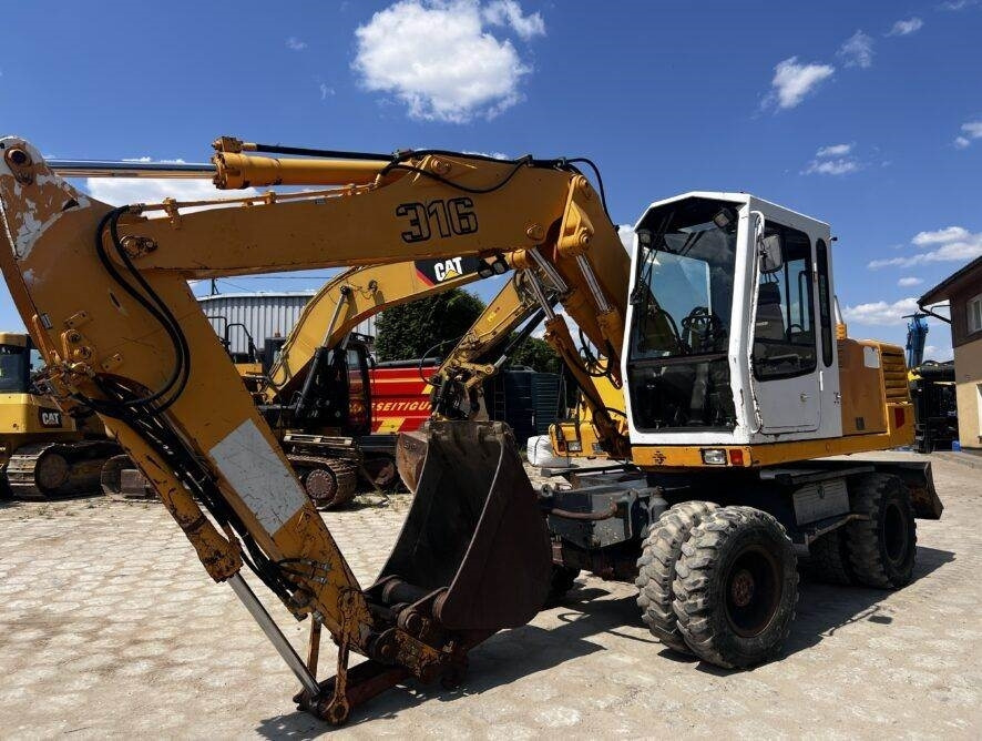 Liebherr A316 - Bager na kolesih: slika 1 Liebherr A316 - Bager na kolesih: slika 1