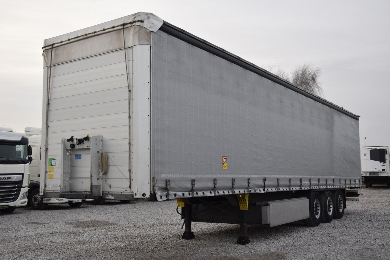 Schmitz Cargobull SCS24/L Lifting Axle - Polprikolica s ponjavo: slika 1 Schmitz Cargobull SCS24/L Lifting Axle - Polprikolica s ponjavo: slika 1