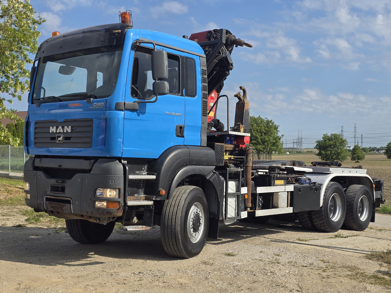 MAN TGA 33.430 6X6 / HMF 1823 K3+REM.CON./ HOOK SYSTEM - Kotalni prekucni tovornjak, Tovornjak z dvigalom: slika 1 MAN TGA 33.430 6X6 / HMF 1823 K3+REM.CON./ HOOK SYSTEM - Kotalni prekucni tovornjak, Tovornjak z dvigalom: slika 1