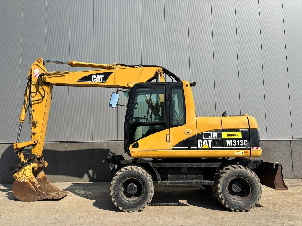 CAT M 313 C (Low verified hours) - Bager na kolesih: slika 1 CAT M 313 C (Low verified hours) - Bager na kolesih: slika 1