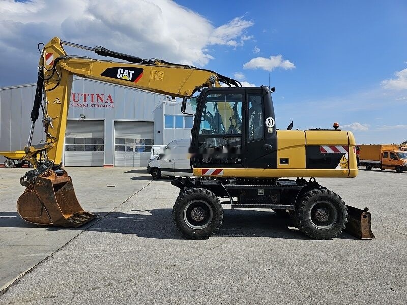 Caterpillar M315D - Bager na kolesih: slika 1 Caterpillar M315D - Bager na kolesih: slika 1