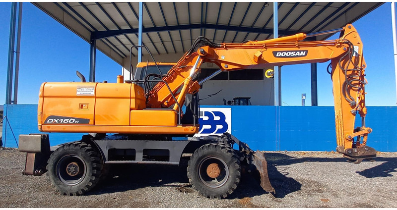 Doosan DX140W-3 - Bager na kolesih: slika 2 Doosan DX140W-3 - Bager na kolesih: slika 2