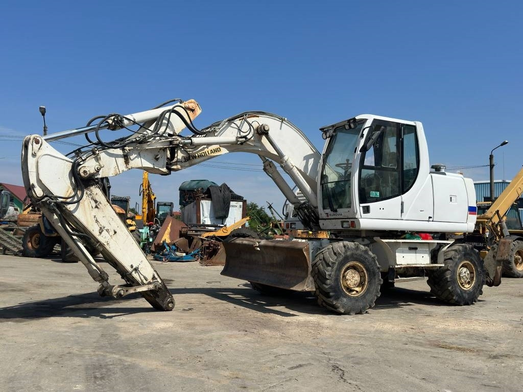New Holland MH Plus - Bager na kolesih: slika 2 New Holland MH Plus - Bager na kolesih: slika 2