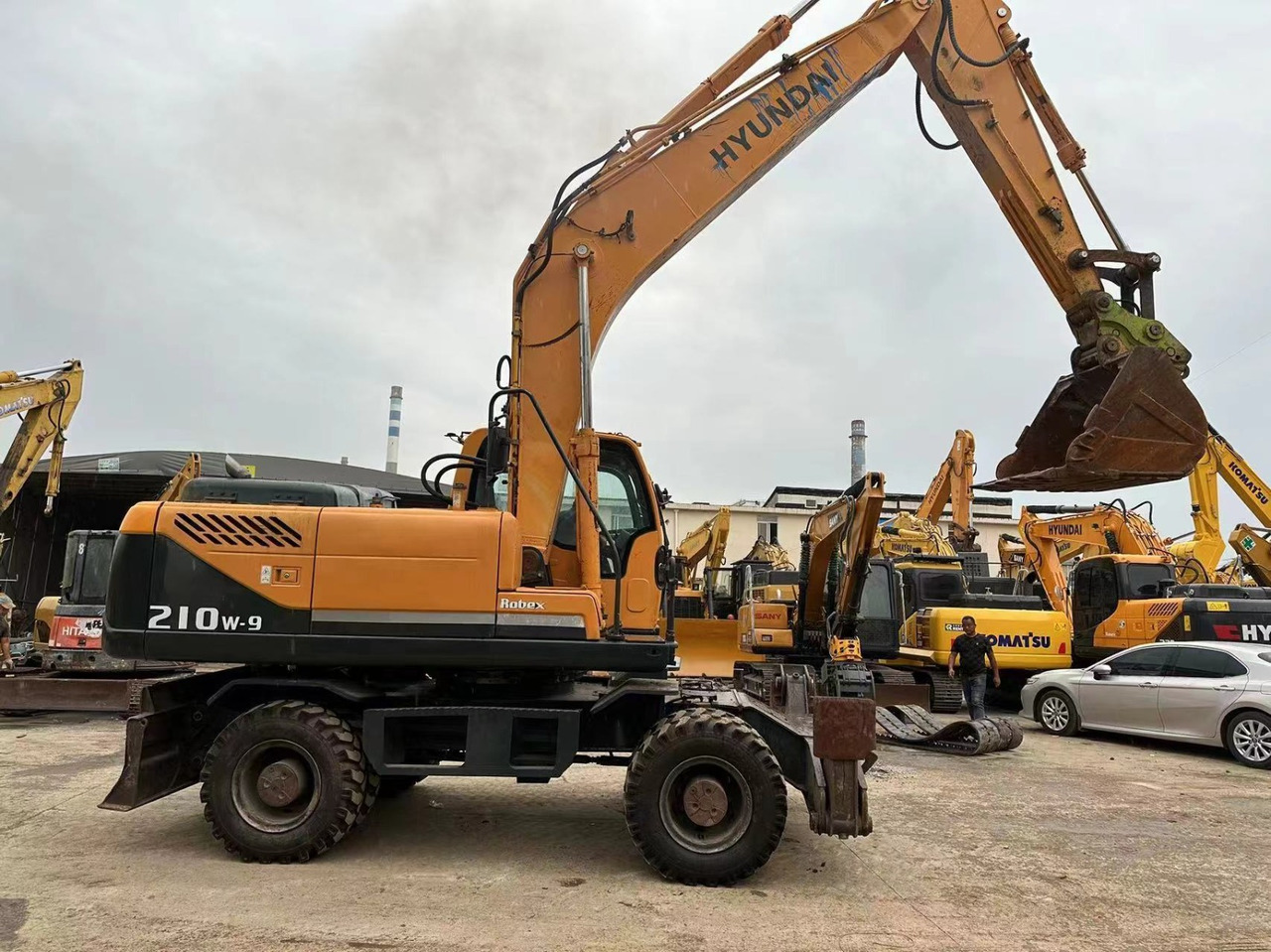 Hyundai 210w-9 - Bager na kolesih: slika 1 Hyundai 210w-9 - Bager na kolesih: slika 1
