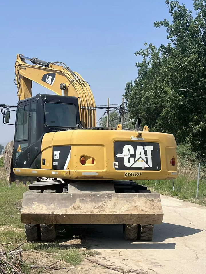 CATERPILLAR M317D2 - Bager na kolesih: slika 2 CATERPILLAR M317D2 - Bager na kolesih: slika 2