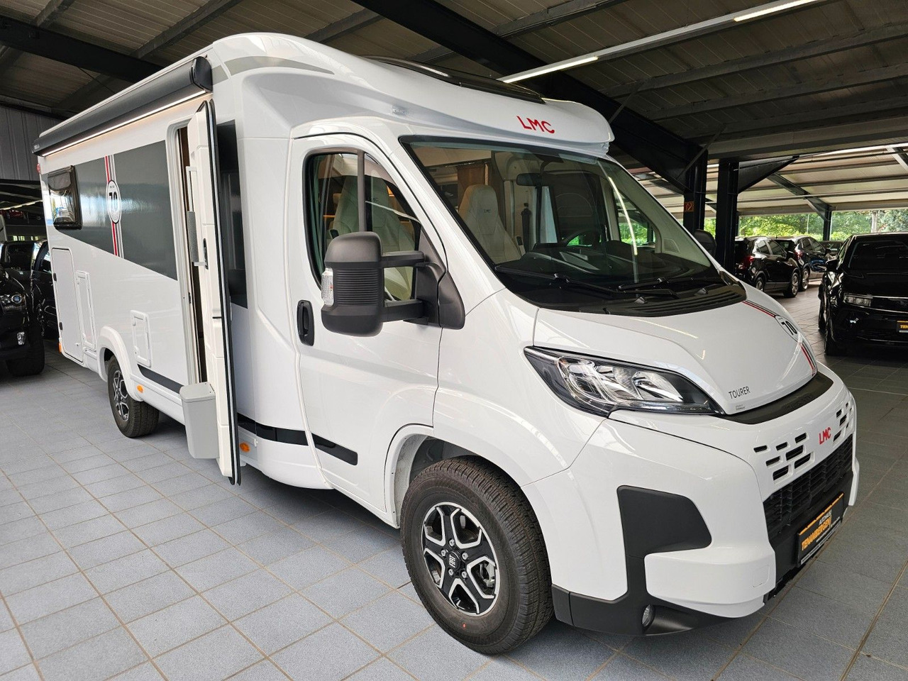 LMC Tourer T660G 70 Jahre AT-8 WC Markise Navi - Polintegriran avtodom: slika 1 LMC Tourer T660G 70 Jahre AT-8 WC Markise Navi - Polintegriran avtodom: slika 1