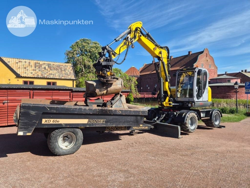 Wacker Neuson EW 100 med vagn - Bager na kolesih: slika 1 Wacker Neuson EW 100 med vagn - Bager na kolesih: slika 1