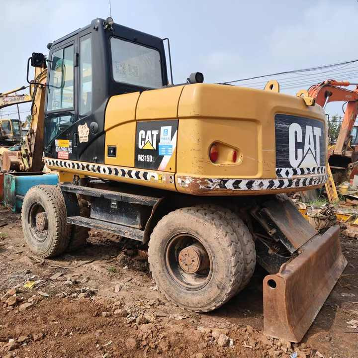 Used Digger Cat 315 Construction Machinery Construction Digger Used Cat 315 Cheap Excavator - Bager na kolesih: slika 1 Used Digger Cat 315 Construction Machinery Construction Digger Used Cat 315 Cheap Excavator - Bager na kolesih: slika 1