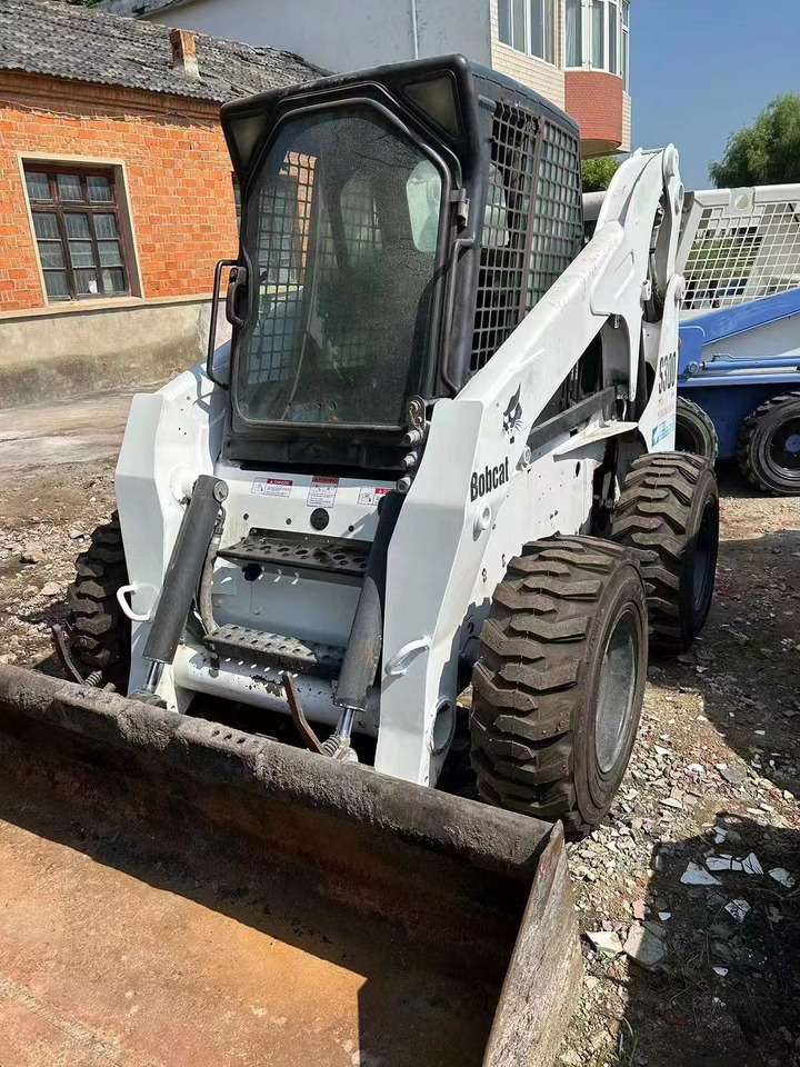 High Quality Mini Construction Machine Used Bobcat Skid Steer Loader S300 in Stock for Sale Bobcat Loader With Low Price - Mini nakladalec: slika 1 High Quality Mini Construction Machine Used Bobcat Skid Steer Loader S300 in Stock for Sale Bobcat Loader With Low Price - Mini nakladalec: slika 1