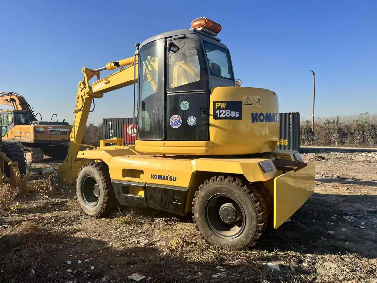 KOMATSU PC128US - Bager na kolesih: slika 1 KOMATSU PC128US - Bager na kolesih: slika 1