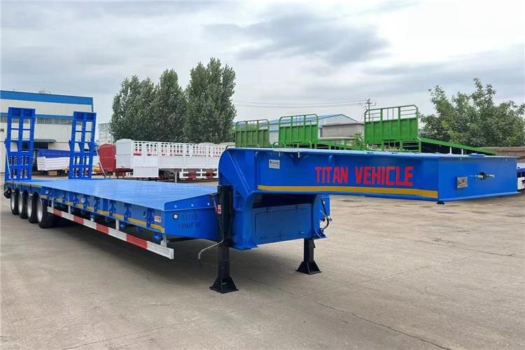 TITAN 4 Axle Low Bed Truck Trailer for Sale In Philippines - Nizko noseča polprikolica: slika 1 TITAN 4 Axle Low Bed Truck Trailer for Sale In Philippines - Nizko noseča polprikolica: slika 1
