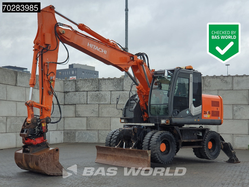 Hitachi ZX140W -3 OUTRIGGERS - ROTOTILT - Bager na kolesih: slika 1 Hitachi ZX140W -3 OUTRIGGERS - ROTOTILT - Bager na kolesih: slika 1
