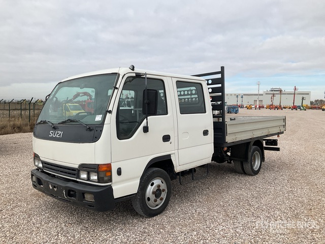 2006 Isuzu NPR77 4x2 Crew Cab Flatbed Truck - Tovornjak s kesonom: slika 1 2006 Isuzu NPR77 4x2 Crew Cab Flatbed Truck - Tovornjak s kesonom: slika 1