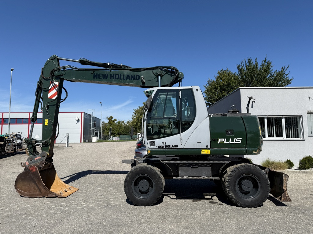 New Holland MH-Plus (111695) - Bager na kolesih: slika 1 New Holland MH-Plus (111695) - Bager na kolesih: slika 1