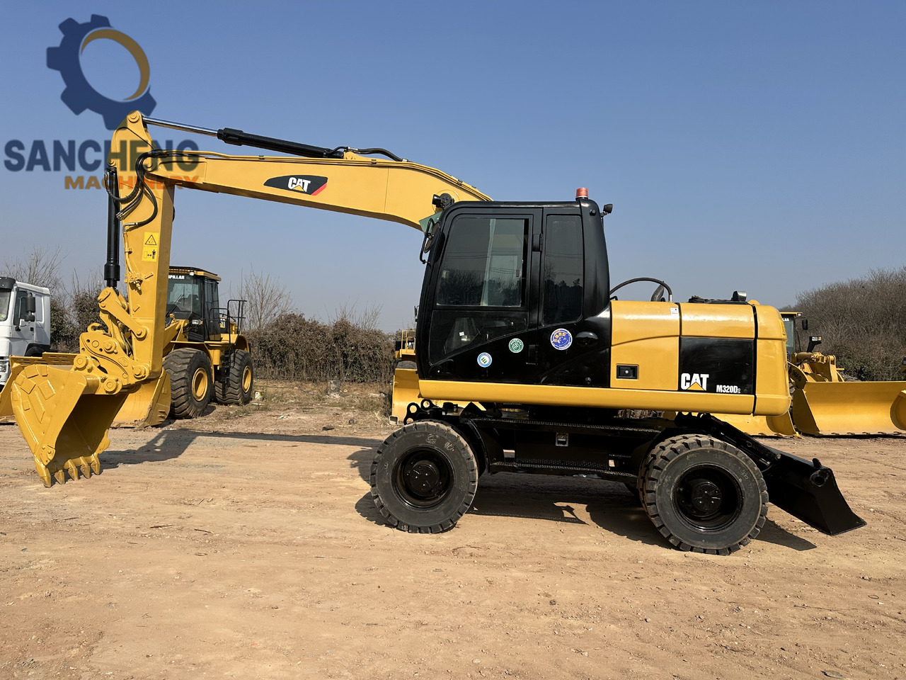 CATERPILLAR M320D2 - Bager na kolesih: slika 2 CATERPILLAR M320D2 - Bager na kolesih: slika 2