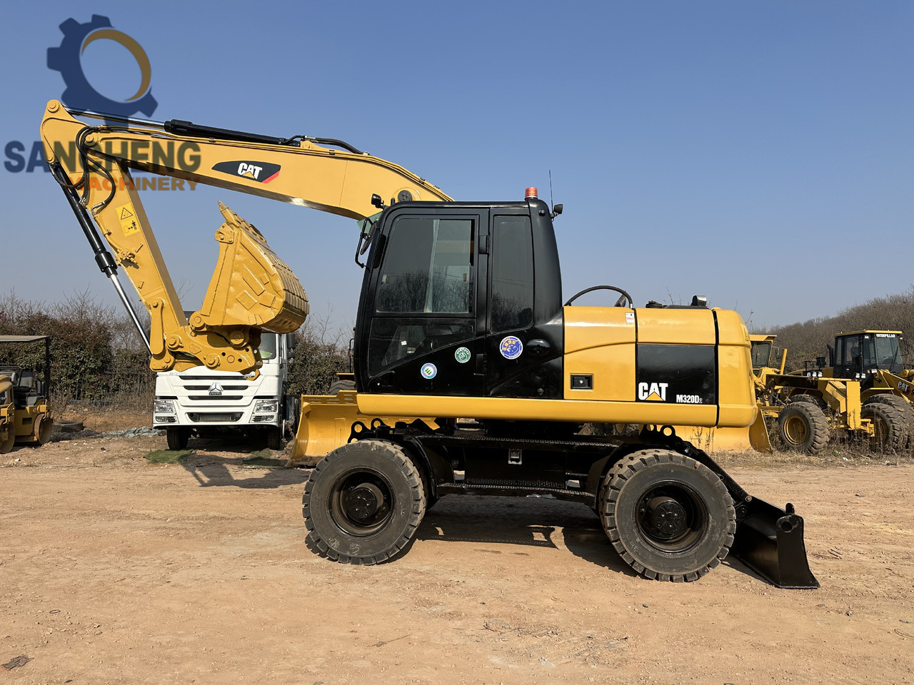 CATERPILLAR M320D2 - Bager na kolesih: slika 1 CATERPILLAR M320D2 - Bager na kolesih: slika 1