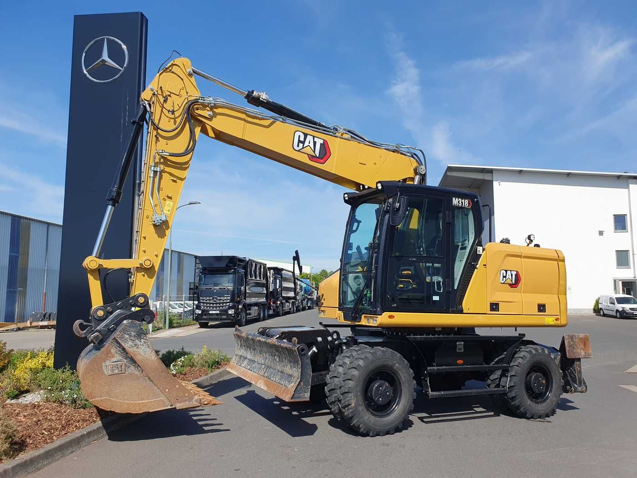 CAT M318 / 2022 / nur 286h! / Tieflöffel / Pratzen - Bager na kolesih: slika 1 CAT M318 / 2022 / nur 286h! / Tieflöffel / Pratzen - Bager na kolesih: slika 1