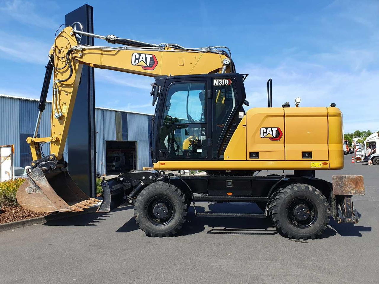CAT M318 / 2022 / nur 286h! / Tieflöffel / Pratzen - Bager na kolesih: slika 2 CAT M318 / 2022 / nur 286h! / Tieflöffel / Pratzen - Bager na kolesih: slika 2