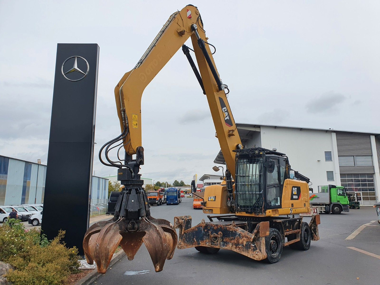 CAT MH3024 / MH 3024 / Greifer / 2018 / 9.424h - Bager na kolesih: slika 1 CAT MH3024 / MH 3024 / Greifer / 2018 / 9.424h - Bager na kolesih: slika 1